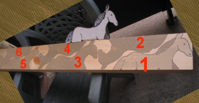 A 2X6 beam with traced designs of a horse, ready to be cut out using an electric jig saw1