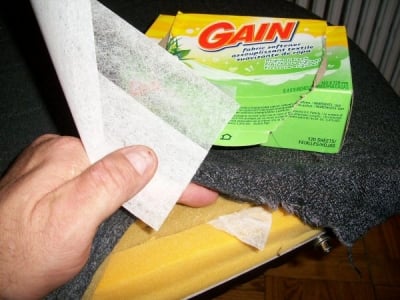 with the upholstery unhooked, stuff some fabric softener sheets under the fabric